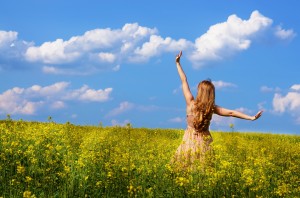 Young woman at canola field